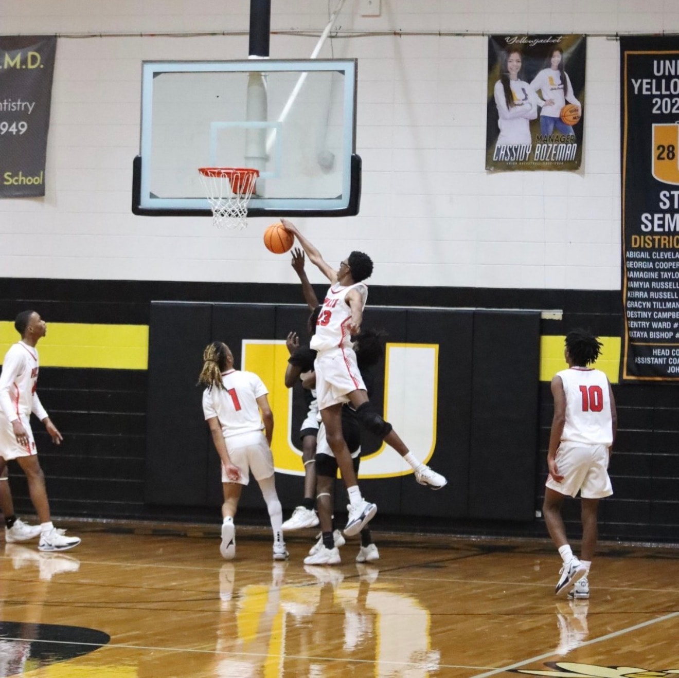 Basketball player practicing on an indoor court